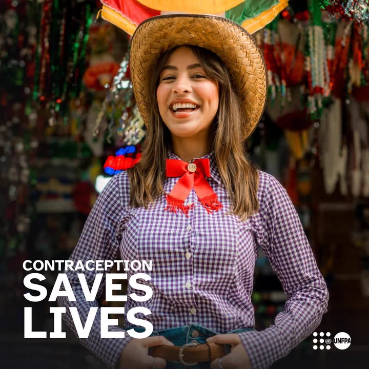 A photo of a smiling young woman wearing a straw hat and a purple checkered shirt stands in front of a festive, colorful market backdrop. Bold white text in the bottom left reads "CONTRACEPTION SAVES LIVES." The UNFPA logo is in the bottom right.