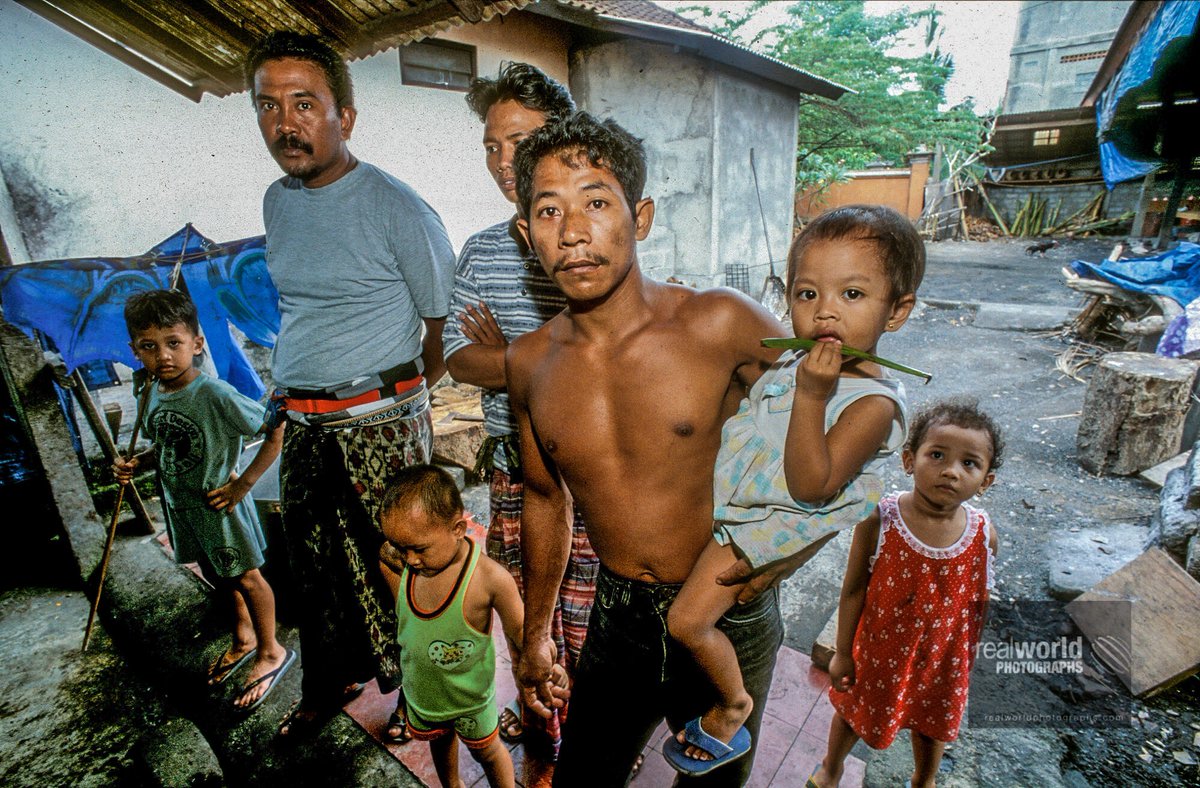 RealWorldImage's tweet photo. A group of Denpasar locals gather out of curiosity. Bali, Indonesia. Gary Moore photo. Real World Photograph. #Grok #travel #garymoorephotography #realworldphotographs #poverty #photojournalism #world #travelphotography #Nikon #people #places #Bali #Denpasar #Indonesia #photo https://t.co/7K9xxogfqu