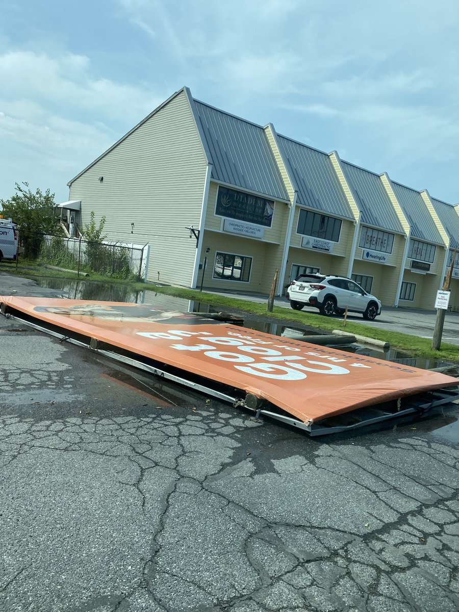 tflo_wx1317's tweet photo. @NWS_MountHolly storm damage from last night. Billboard snapped off its poles on Savannah road in Lewes, DE. #DEwx https://t.co/46umqWzEDy