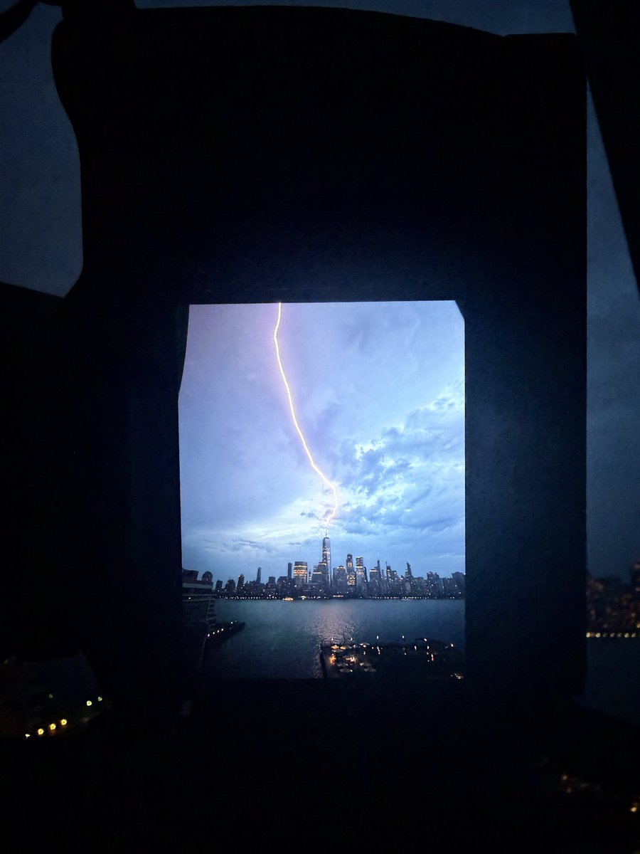 DanTVusa's tweet photo. ⚡️Strike⚡️
Lightning strike zapping the @_WTCOfficial spire. 
#NewYorkCity #storm https://t.co/Bv9zKffCHq