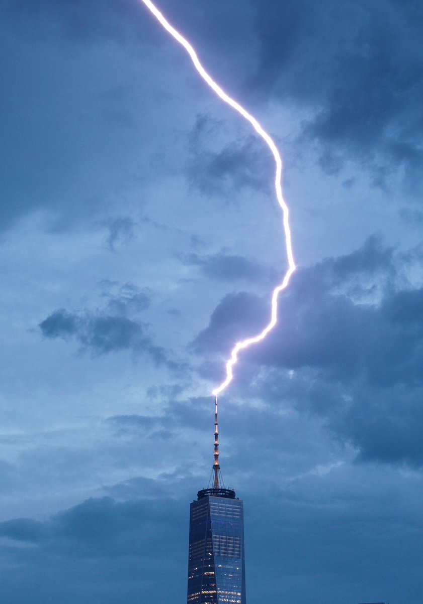 DanTVusa's tweet photo. ⚡️Strike⚡️
Lightning strike zapping the @_WTCOfficial spire. 
#NewYorkCity #storm https://t.co/Bv9zKffCHq