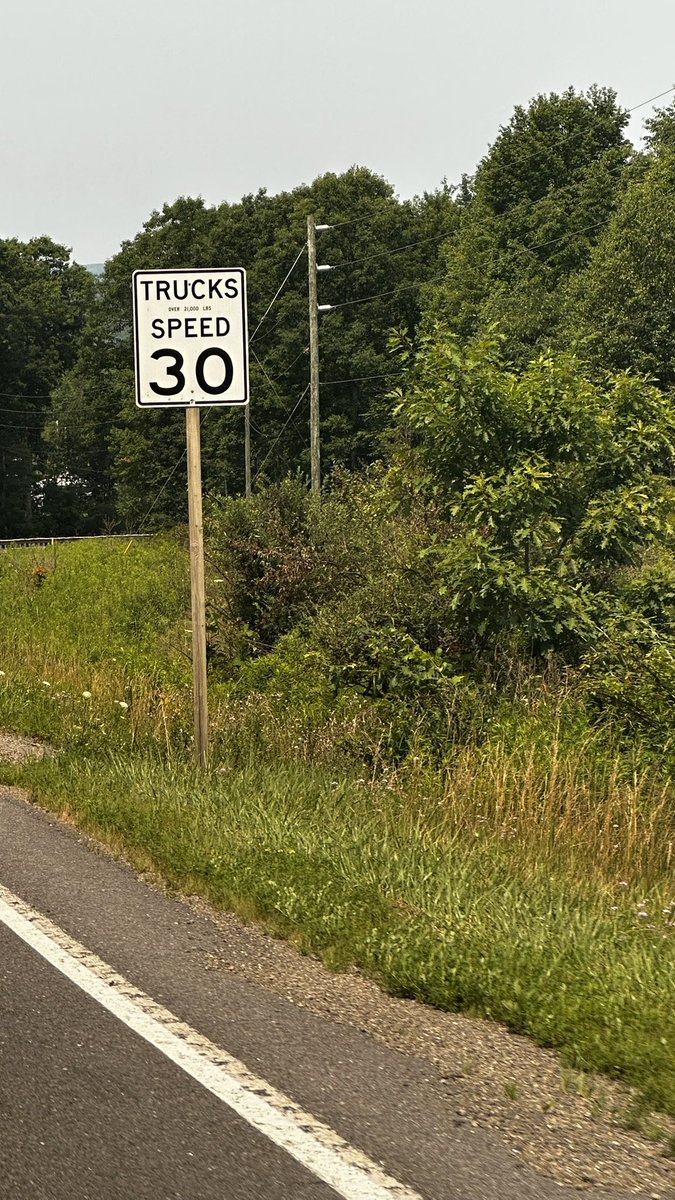 R0ssCarter's tweet photo. Hey @elonmusk , Found what looks like a safety edge case for FSD couple of days ago in Pennsylvania (Route 153 near Brockport). The road only had “TRUCKS SPEED 20/30” signs with no separate passenger vehicle speed limit posted nearby. FSD appeared to ignore the word “TRUCKS” and immediately treated 20 mph as the new speed limit, braking aggressively from ~46 mph. Fortunately nobody was behind me, but this could easily cause a rear end collision. Seems like FSD should distinguish truck only speed signs from passenger vehicle speed limits.