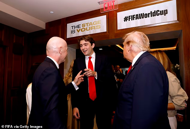 Mollyploofkins's tweet photo. Barron wearing one of his father's clown-sized red ties https://t.co/TDqRqkFeBp