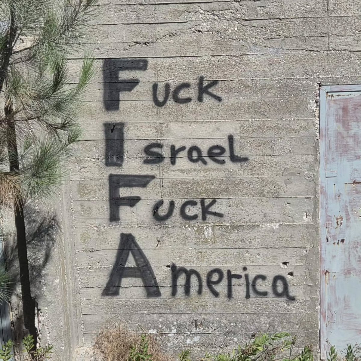 GraffitiRadical's tweet photo. FIFA graffiti seen in Jerusalem https://t.co/ngIxGJK6ss