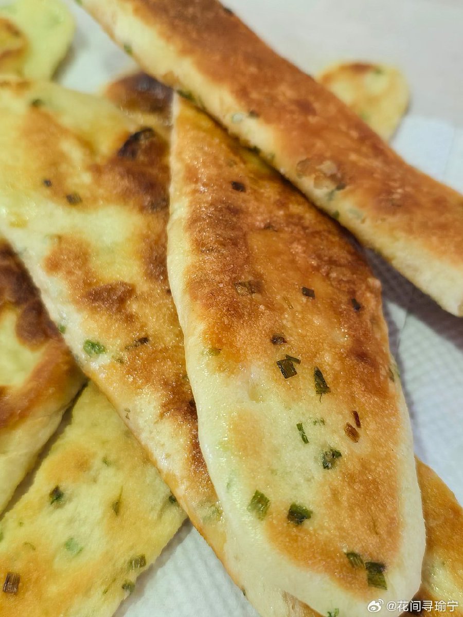 Maruisoo's tweet photo. Craving warm crispy scallion pancake from the street cart  Best late-night snack in the city, fresh off the griddle and so tasty! https://t.co/aXcxYoWCWi
