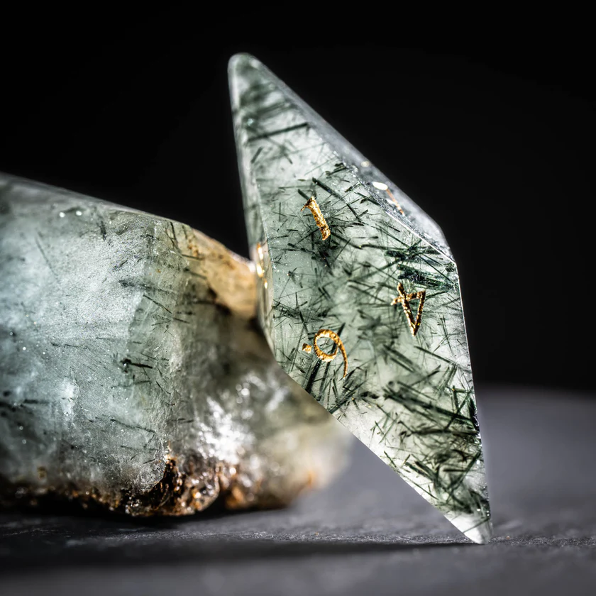 urwizards's tweet photo. Stone texture. Golden numbers.Quiet forest magic. Green Rutilated Quartz dice.

#dnddice #ttrpgdice #gemstonedice #dicegoblin https://t.co/e1dzVaRjvv