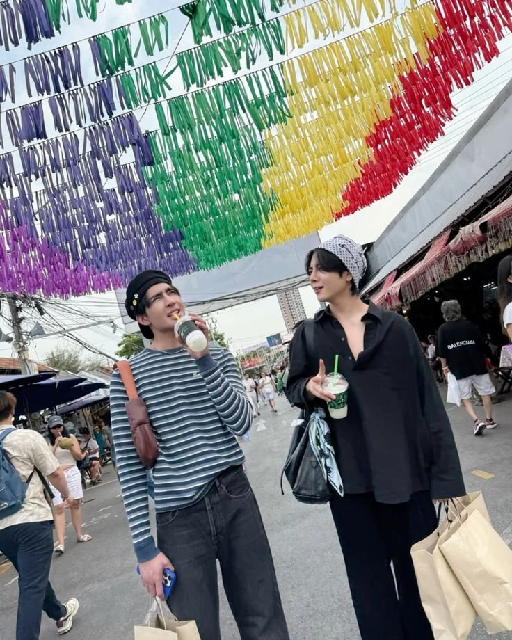 yapnilsc's tweet photo. their date at a market with rainbow flags over their heads.... we know exactly what you two are 🏳️‍🌈 https://t.co/NetnQIIHO5
