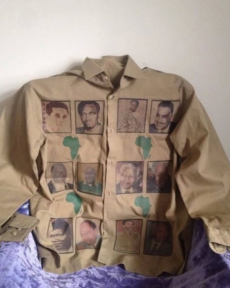 rogue's tweet photo. Muammar Gaddafi wore this custom shirt covered in portraits of legendary independence-era heroes to spark intense debate https://t.co/uLTqxdcbiW