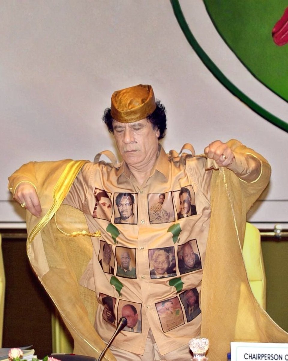 rogue's tweet photo. Muammar Gaddafi wore this custom shirt covered in portraits of legendary independence-era heroes to spark intense debate https://t.co/uLTqxdcbiW