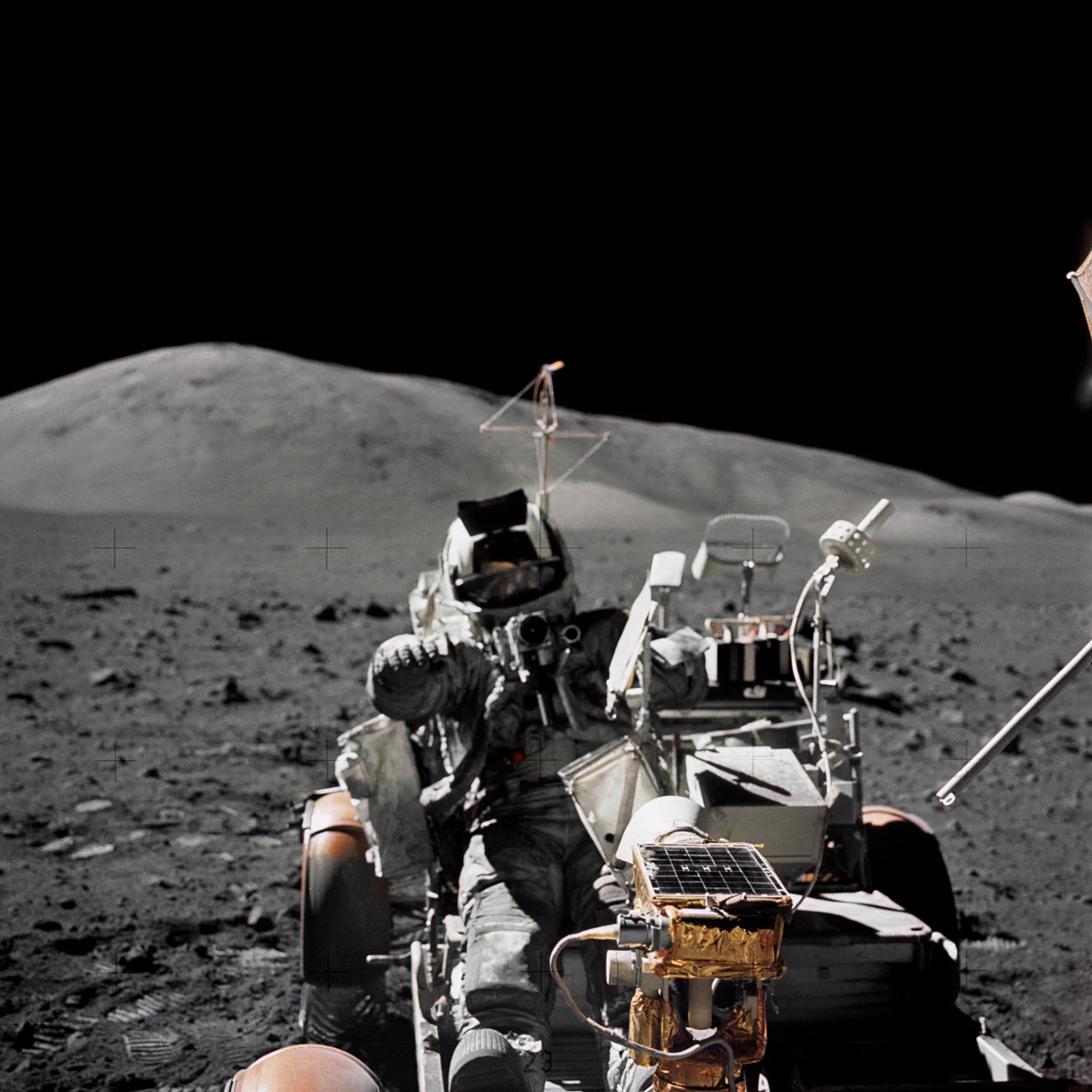 Scientist-astronaut Harrison H. Schmitt is photographed seated in the Lunar Roving Vehicle (LRV) at Station 9 (Van Serg Crater) during the third Apollo 17 extravehicular activity (EVA) at the Taurus-Littrow landing site. This photograph was taken by astronaut Eugene A. Cernan, commander. Schmitt, lunar module pilot, and Cernan explored the moon while astronaut Ronald E. Evans, command module pilot, remained with the Command and Service Modules in lunar orbit. Credit: NASA
