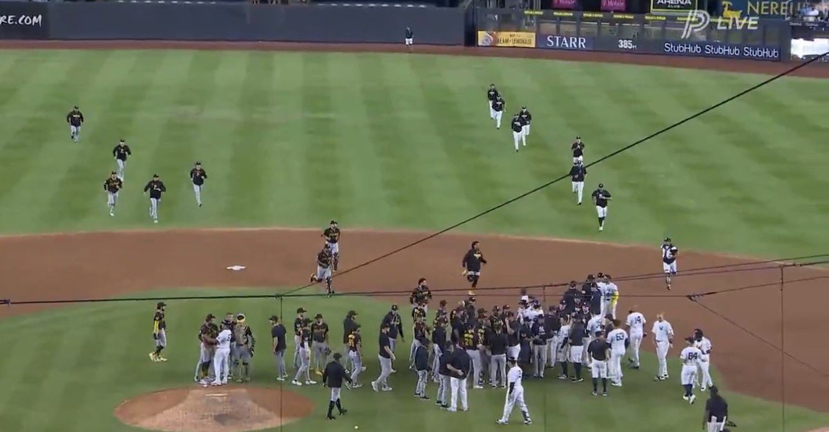 npc210's tweet photo. Pirates players rush to the mound to stop Dennis Santana from pitching: https://t.co/A0qS1TZRMr
