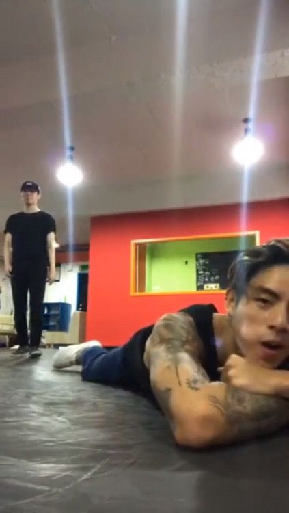 scaredy_cat44's tweet photo. WHAT IS THIS PICTURE LMAO, ian laying on the floor while the person in the back is just standing there like 🧍‍♂️ https://t.co/Ke61m5FsQL