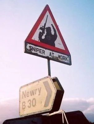 FromKulak's tweet photo. In the 70s, 80s and 90s the IRA would put up "Snipers at Work" road-signs throughout Northern Ireland where they had shot Police and Security forces previously.

The Army and Police considered this a core concern to take these signs down so that lawlessness would not be perceived to rule throughout the 6 counties.

So the IRA booby-trapped them, rigged them with explosives, and set up sniper hides viewing the various signs.

.

Ultimately if people keep tearing down the Flock Cameras, and Flock keeps putting them up it will escalate to one or the other sides booby trapping them. And then that side will win.

Likewise the first wave of Speeding Cameras in Arizona in the 2000s was stopped when they were shot out, and then the Technician ambushed and shot (and badly wounded) when he came to repair the cameras.

A $2500 Camera, or the risk of getting caught in minor vandalism, is nothing compared to the roughly $5-10 million cost (according to actuaries) of a western human life. One could be put up, or taken down over 1000 times and not be equivalent to one lost technician or vandal.

Violence is the supreme authority from which all authority is derived.

Ultimately all political struggles are solved by one side or the other escalating to sufficient violence to break the other, or exhausting them with low level violence.

Nowhere is this more dramatic and apparent than these lone low cost assets scattered throughout the countryside... Both sides can put them up and take them down in infinite numbers. Both sides can do this for years or even decades... Yet whenever one side escalates to lethal force, suddenly these things tend to be decided one way or the other.