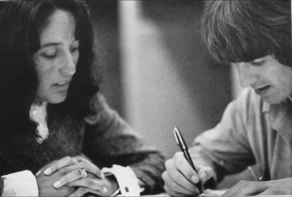 seegerism's tweet photo. she looks like she's teaching him how to write his name https://t.co/icd0EX3XWE
