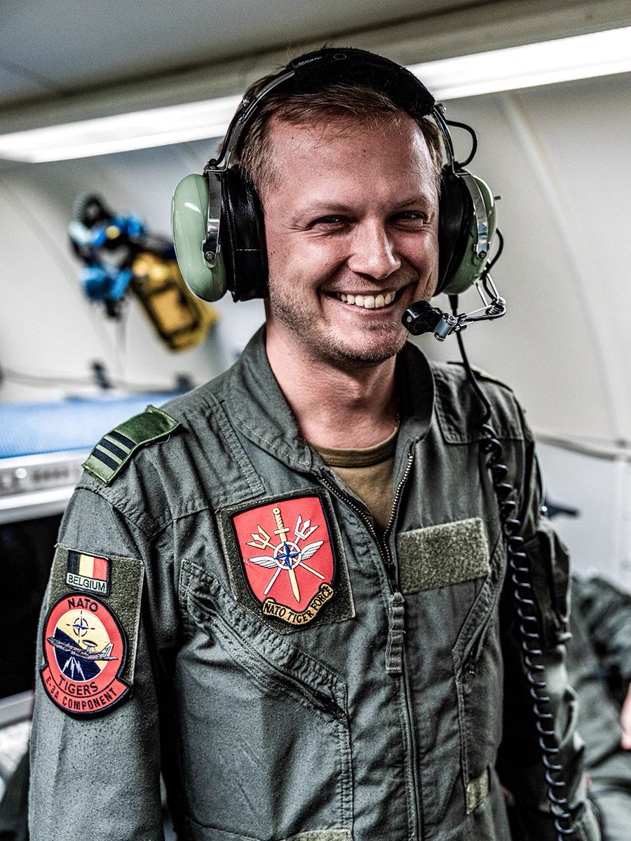 A Belgian aircrew member aboard a NATO E-3A Airborne Warning and Control System (AWACS) aircraft.