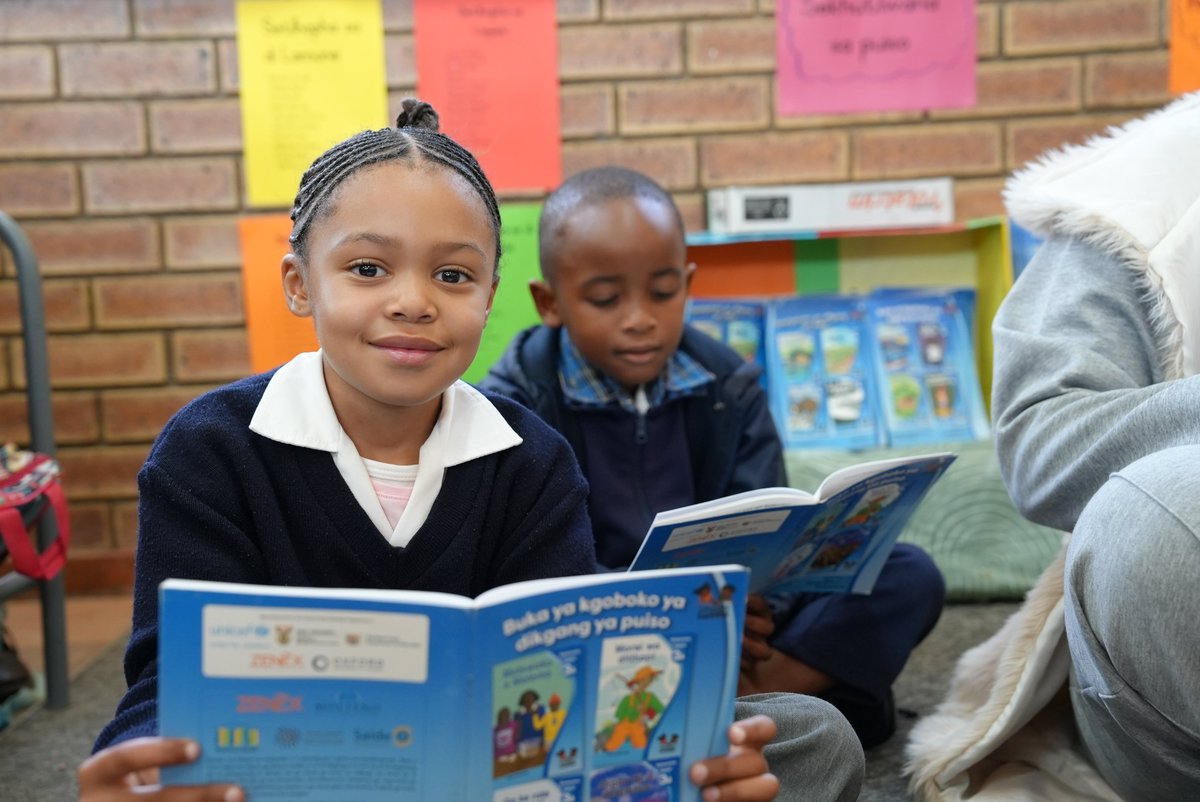 UNICEF_SA's tweet photo. Classrooms are buzzing with activity as children head #BackToSchool today. 🏫

For children like Bokamoso, a new school term means more time doing what she loves most: reading. 📚💙

UNICEF South Africa wishes all learners, teachers and school staff the best for the third term. https://t.co/wbQXxDvZdl