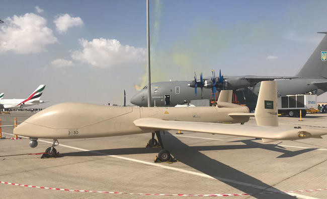 BashaReport's tweet photo. As signs point to a possible increase in Houthi threats against Saudi Arabia, the sound of war drums is growing louder. If attacks intensify, the @modgovksa Royal Saudi Air Force will once again be the Kingdom's tip of the spear, leading the air campaign to defend Saudi territory.

The RSAF fields around 30,000 personnel and more than 900 aircraft. Its southern posture is anchored by King Khalid Air Base at Khamis Mushait, home to Wing 5 and Wing 12. The base hosts No. 6 Squadron, No. 55 Squadron, No. 66 Squadron, No. 99 Squadron, and the Kingdom's UAV force including No. 100, 201, 202, 203, and 204 Squadrons. This mix provides F-15SA strike fighters, helicopters, and armed drones positioned closest to the Yemeni border.

Supporting operations are King Fahd Air Base at Taif and Prince Sultan Air Base at Al Kharj. Taif hosts Wings 2, 9, and 10, including No. 3, 5, 10, 14, 33, 34, 44, 80, and 94 Squadrons, operating Eurofighter Typhoons, F-15C/S fighters, and helicopter units. 

Prince Sultan Air Base hosts Wings 4 and 6, including No. 18 Squadron with E-3A AWACS aircraft, No. 23 Squadron with KE-3A aerial refueling aircraft, No. 24 Squadron with A330 MRTT tankers, No. 32 Squadron with KC-130 tankers, and No. 19 and 71 Squadrons supporting ISR and operational conversion.

These bases form the backbone of Saudi Arabia's southern air campaign capability. Their combination of fighters, airborne early warning, aerial refueling, ISR, transport, helicopters, and drones enables sustained operations against missile and drone threats while maintaining air superiority over the southern theater.
