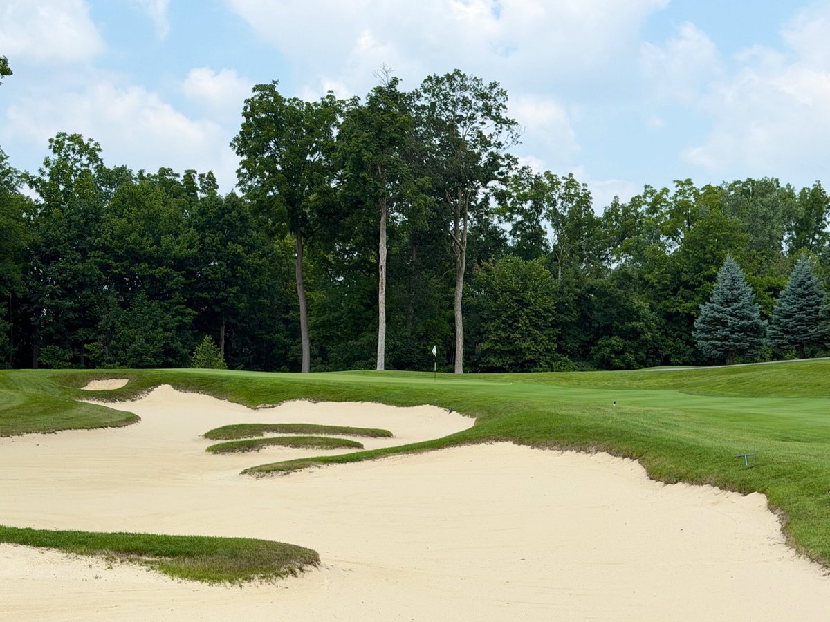 GCAJoeA's tweet photo. Sycamore Hills GC
1989 Jack Nicklaus
Ft Wayne, IN

Located in northeast region of the Hoosier state, Sycamore Hills sits on a piece of land that is filled with rolling hills, lakes, and streams. A fabulous parkland setting for the golf course.

The routing is exceptional. Holes play in all directions of the golf course. They play through a residential community but do not feel tight or constricted. The lengths of each par vary and you don’t feel you’re playing the same hole twice at any point. 

The fairways at Sycamore are pretty generous in width. You are offered some challenges to use driver to get your ball at a proper angle to the green, but those areas tend to pinch or be guarded by a devious bunker or waste area. You must be precise. The greens vary in size and shape and have great contouring throughout. As expected the bunkers are pearly white sand and offer a visually aesthetic appeal.

The conditions at SH are pristine. @JTgolfsuptSHGC and his staff have the golf course dialed in. The fairways are a lush green but they do run firm and fast throughout. The green complex surfaces are excellent. Just the right amount of firmness to them and easily roll at 12 or above on the stimp. 

As expected, the clubhouse and professional staff are on top of their games at all times. This is a five star service facility in every way. The food/menu is spectacular, the locker and grill rooms are great, and the guest cottages are spa/resort quality. If you have an opportunity to go to Sycamore Hills, do not pass up the chance. Kudos to all at SH, I’ll be back for sure.