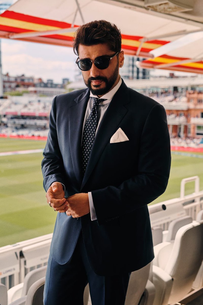 HELLOmagIndia's tweet photo. If timeless #RalphLauren had a Bollywood face, #ArjunKapoor would be it. Invited to the #IndiavsEngland match at #Lord's, he delivered effortless menswear in a tailored navy suit, while #JanhviKapoor aced polished power dressing in pinstripes. #HELLOIndia #HELLOMagazine https://t.co/x3gZO95Rpf