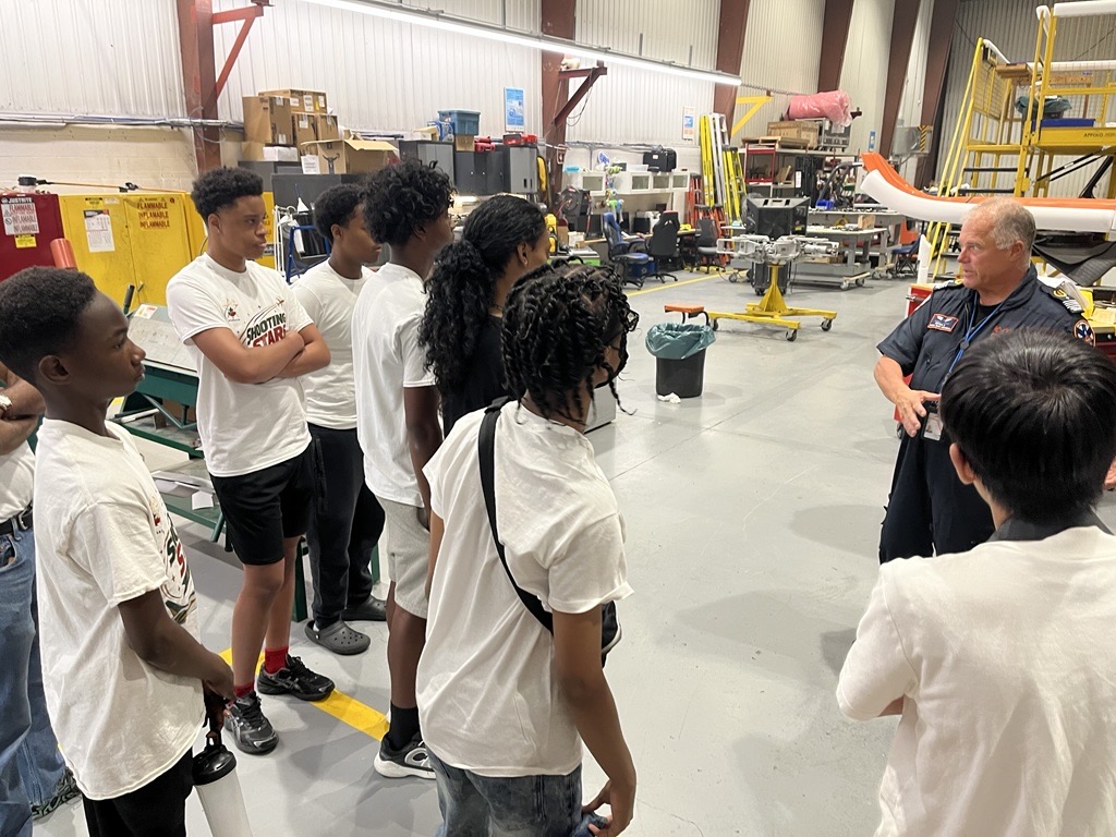 Ornge's tweet photo. This past Thursday the Shooting Stars Academy from camp visited our Toronto base. Campers heard from pilots and paramedics and what it is like to be Ontario's air ambulance service provider. 

We thank all the 799 staff who participated in the camp visit.
#teamOrnge https://t.co/AEscl64lWM