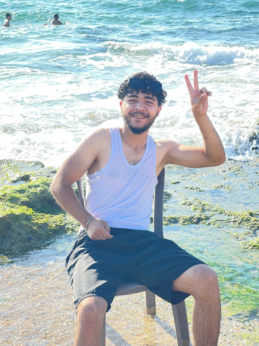 Abdullah_Om3r03's tweet photo. They see a smile. They see the sea. They see a peaceful moment.
But what they don't see is everything that came before this photo.
They don't see the sleepless nights, the fear that never truly leaves, the memories that refuse to fade, or the weight carried silently every single day.
Sometimes people think that one smile means everything is okay. The truth is, it doesn't.
A smile can simply mean that you are trying your best not to fall apart.
I have learned that life can change in a single moment. It can take away people you love, places you call home, and dreams you spent years building.
Yet somehow, we continue.
We keep walking, even when our hearts are exhausted. We keep hoping, even when hope feels distant. We keep smiling, not because life is easy, but because giving up is not an option.
Sitting by the sea today reminded me of something important. No matter how strong the waves become, they always return to calm. Maybe our lives are the same.
Maybe one day, this pain will become a memory instead of our reality. Maybe one day, we will wake up without fear. Maybe one day, peace will no longer be a dream.
Until that day comes, I will keep believing. I will keep smiling. I will keep moving forward, one step at a time.
Because even after everything life has taken from me, it has never taken away my faith that better days can still come.
With love, Abdullah Omar. 🤍🌊