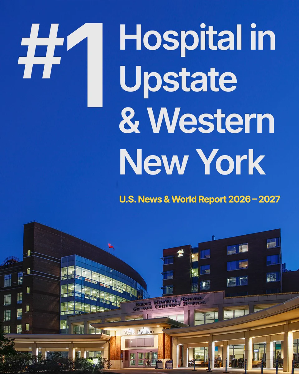 Exterior of Strong Memorial Hospital at dusk, with a text above in dark blue sky "#1 Hospital in Upstate & Western New York. U.S. News & World Report 2026-2027"