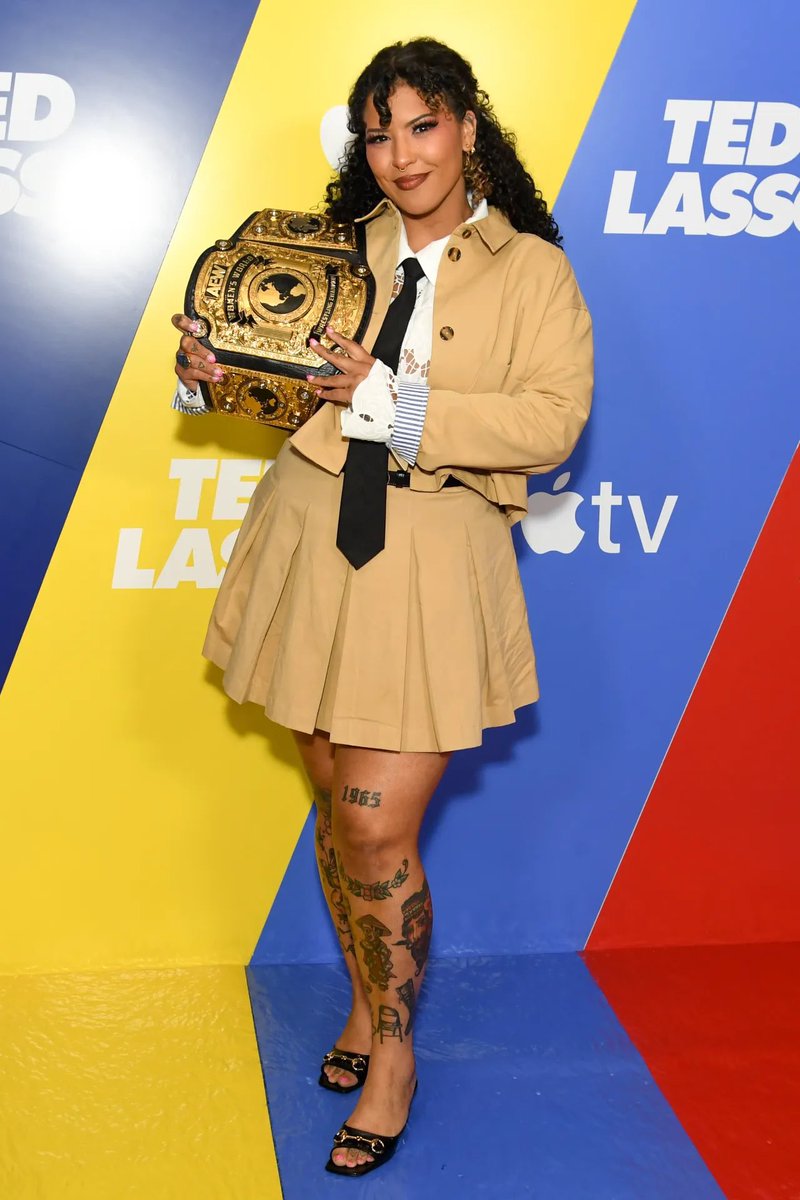 ButSmileAnyway's tweet photo. I’m so incredibly proud to carry this championship everywhere I go, and getting to do that at the Ted Lasso premiere? That’s one of those moments I’ll be smiling about for a long, long time. https://t.co/ayGsYkyoyM