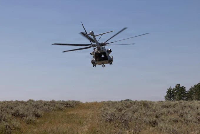 U.S. Marine Corps CH-53K King Stallions with Marine Heavy Helicopter Squadron (HMH) 461, Marine Aircraft Group 29, 2nd Marine Aircraft Wing, prepare to land during a simulated tactical recovery of aircraft and personnel near Helena, Montana, July 26, 2026. HMH-461 conducted a Marine Corps Combat Readiness Evaluation to ensure readiness for future deployments and operations. The MCCRE is a formal evaluation of an operational unit based on approved Marine Corps training and readiness tasks, conditions, and standards to ensure combat readiness. (U.S. Marine Corps photo by Lance Cpl. Perri Wood)\n\n