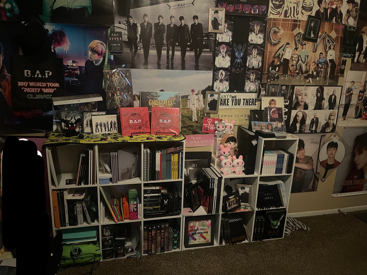 dwayji's tweet photo. the difference in time.. 😭 lately i'm thinking.. younger me would be so shocked how my room was consumed with BAP merch 🫡
my boys forever ot5 🫡💕

(its not even an up to date photo.. between daehyun and zelo's albums 😭 ) https://t.co/y3lGArletJ