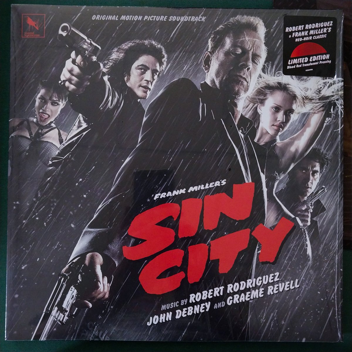 MoniFunGirl's tweet photo. Got something in the post today, just opened it. 😃

I love getting vinyl in the mailbox! 📬 

They finally released the Sin City movie soundtrack on vinyl earlier this year. I ordered the transparent red variant from the Varèse Sarabande website. 

This is the same label that dominated the soundtrack market in the late 70s and all of the 80s! Nice to see them going strong again!