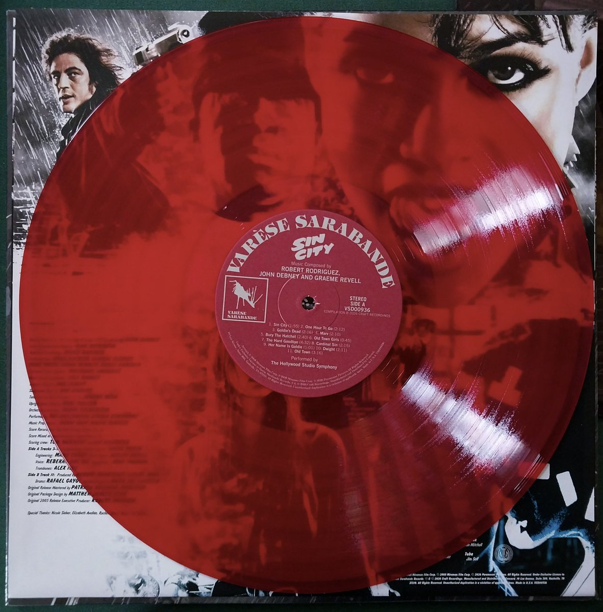 MoniFunGirl's tweet photo. Got something in the post today, just opened it. 😃

I love getting vinyl in the mailbox! 📬 

They finally released the Sin City movie soundtrack on vinyl earlier this year. I ordered the transparent red variant from the Varèse Sarabande website. 

This is the same label that dominated the soundtrack market in the late 70s and all of the 80s! Nice to see them going strong again!