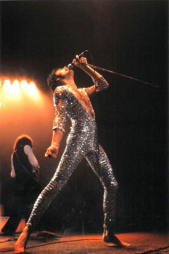 crockpics's tweet photo. Freddie Mercury and Brian May performing live at the Forum in Los Angeles back on March 3, 1977. Dressed in his famous silver sequin jumpsuit and commanding the stage barefoot, Freddie was caught right in his element during Queen's A Day at the Races tour. Photo by Neal Preston 

What is your favorite track from Queen's A Day at the Races?👇️