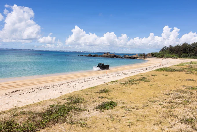 U.S. Marines with Truck Company, Headquarters Battalion, 3rd Marine Division, drive Medium Tactical Vehicle Replacements during a littoral maneuver field exercise on Kin Blue Beach, Okinawa, Japan, July 28, 2026. The field exercise was designed to rehearse littoral operations, prepare for unimproved roads and self-recovery on rough terrain. (U.S. Marine Corps photo by Lance Cpl. Kendrick Jackson)\n\n