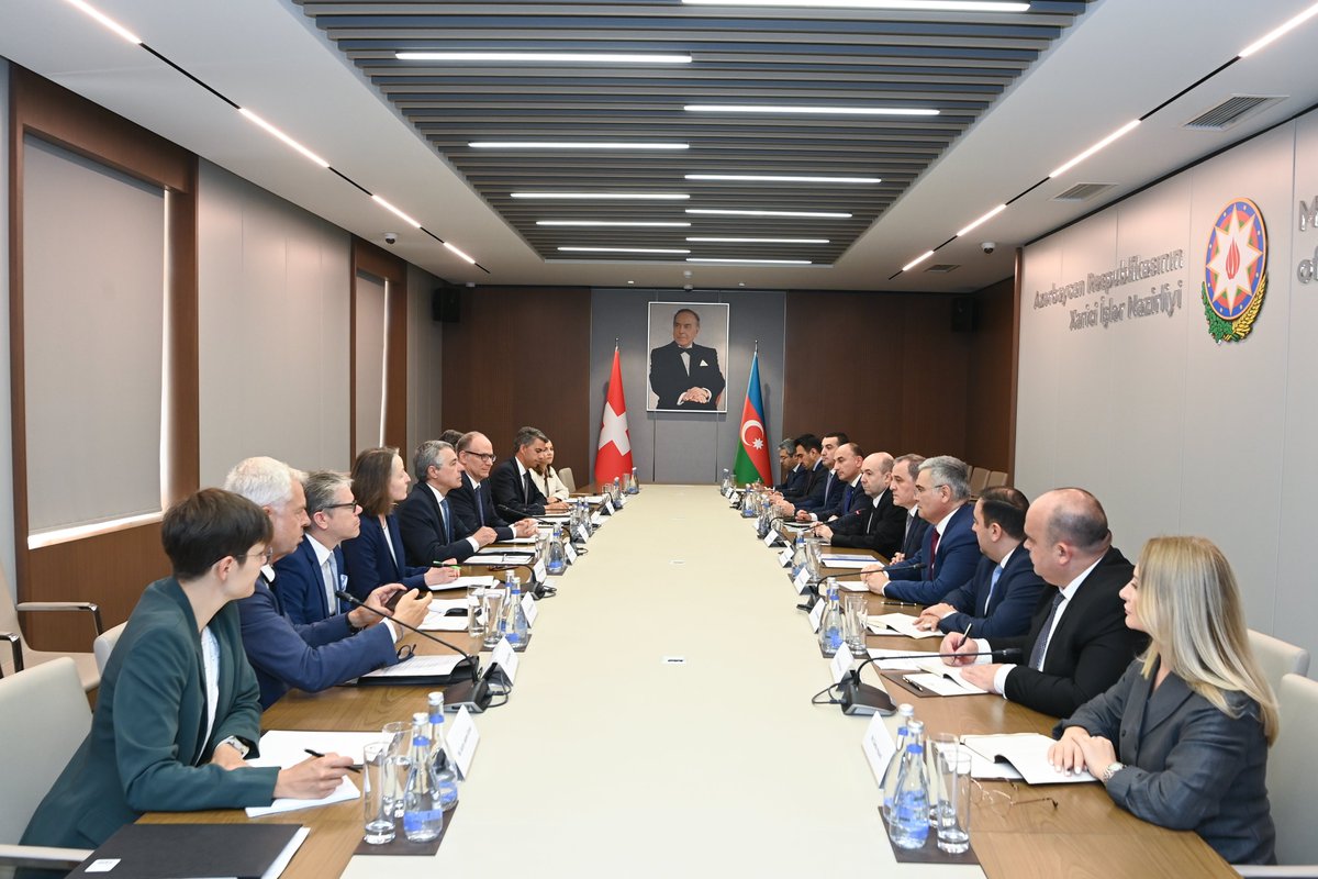 AzerbaijanMFA's tweet photo. The Minister of Foreign Affairs of the Republic of #Azerbaijan Jeyhun Bayramov had an expanded format meeting with the Federal Councillor and Head of the Federal Department of Foreign Affairs of the #SwissConfederation🇨🇭, Chairperson-in-Office of the OSCE Ignazio Cassis, who is on an official visit to Azerbaijan🇦🇿.
 
The Ministers discussed the Azerbaijan-Switzerland bilateral agenda, the priorities of Switzerland's Chairpersonship of the OSCE, the current state and future prospects of Azerbaijan-OSCE cooperation, as well as the post-conflict situation in the region and the Azerbaijan-Armenia normalization process.
 
The Ministers noted that next year Azerbaijan and Switzerland will mark the 35th anniversary of the establishment of diplomatic relations, describing this important milestone as an opportunity to reflect on the partnership developed over the past three and a half decades.
 
The sides noted the importance of maintaining high-level contacts and regular political consultations between the Ministries of Foreign Affairs. In this regard, they underlined the significance of the latest round of political consultations held in Baku in April this year and highlighted the importance of continuing this mechanism on a regular basis.
 
Discussions focused on expanding economic cooperation, including through the activities of the Joint Commission on Trade and Economic Cooperation.
 
The role of the energy sector as one of the key pillars of bilateral economic relations was highlighted. In this regard, the successful operations of SOCAR Energy in Switzerland were noted as an important example of mutually beneficial cooperation.
 
The Ministers also underscored the importance of enhancing cooperation in the fields of culture, education, and science to further strengthen people-to-people ties.
 
Particular attention was paid to Switzerland's priorities as Chairperson-in-Office of the OSCE. Azerbaijan welcomed the Chairpersonship's focus on science and diplomacy, innovative technologies, water resource management, energy security, and digital security, stressing the importance of these areas in addressing contemporary challenges.
 
Minister Jeyhun Bayramov noted that, against the backdrop of the increasingly complex security environment across the OSCE region, the Organization should make full use of its comprehensive security concept and broad geographical membership in order to preserve its relevance and role in addressing regional security issues. He reaffirmed Azerbaijan's support for effective multilateralism based on the principles of the sovereign equality of participating States, mutual respect, inclusive dialogue, and consensus.
 
Addressing the Armenia–Azerbaijan normalization process, Minister Jeyhun Bayramov informed his counterpart about the current stage of the peace process, the de facto peace established between the two countries, and the confidence-building measures undertaken. He emphasized that the progress achieved through the bilateral format once again demonstrates the effectiveness of this approach.
 
Regarding cooperation with the OSCE, Minister Jeyhun Bayramov reaffirmed Azerbaijan's readiness to continue practical cooperation with the Organization in areas of mutual interest where the OSCE possesses relevant expertise and can provide added value.
 
Minister Jeyhun Bayramov also drew attention to the large-scale contamination of Azerbaijan's territories with landmines and other explosive remnants of war, describing it as one of the country's most pressing humanitarian challenges. He underlined the importance of practical support from the OSCE, within its mandate and capabilities, in addressing this issue.
 
During the meeting, views were exchanged on the situation surrounding Ukraine, developments in the Middle East, and other regional and international security issues.