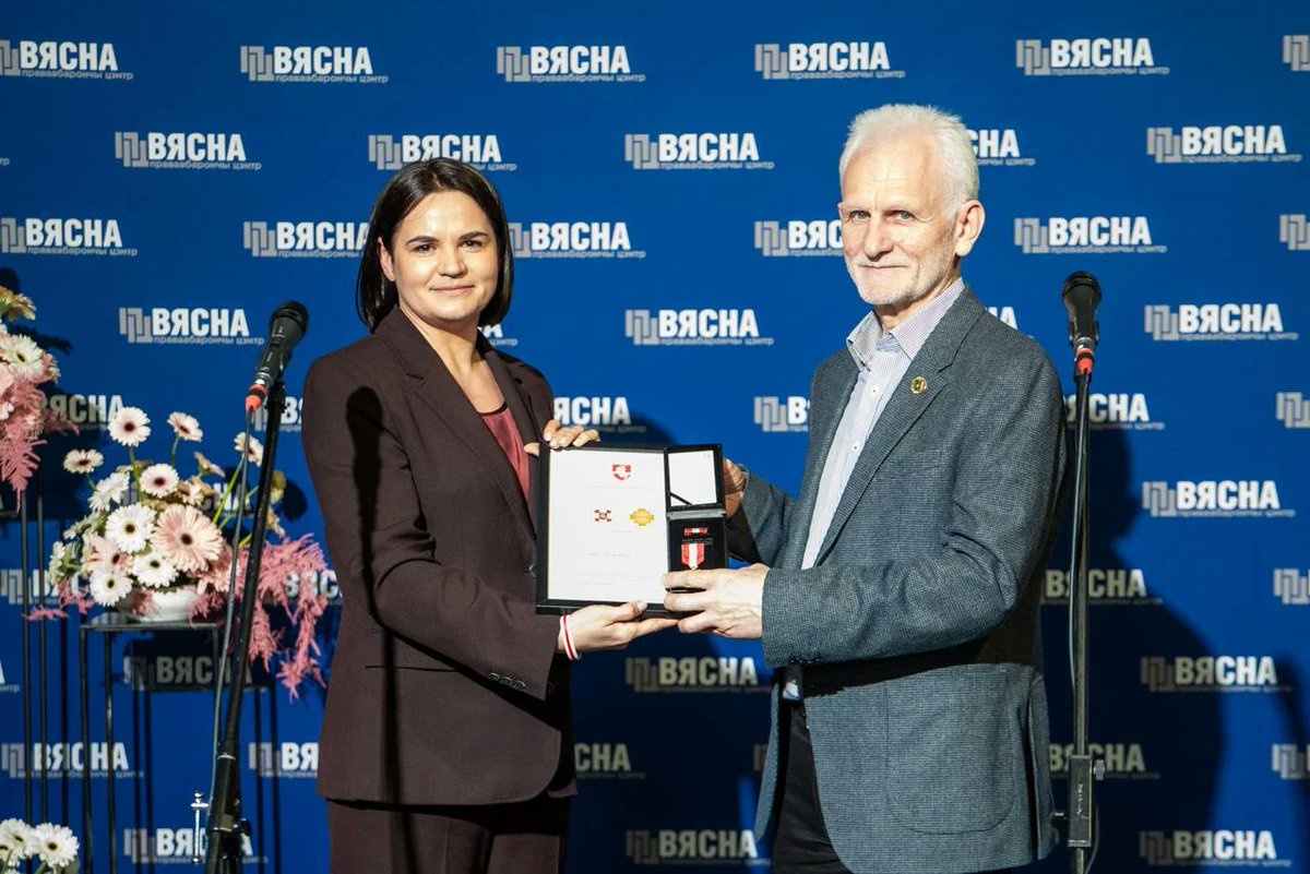 Tsihanouskaya's tweet photo. Fifteen years ago today, the Belarus regime first arrested Ales Bialiatski, founder of @viasna96 &amp; future Nobel Peace Prize laureate. 

In total, he has spent more than 7 years in prison for defending human rights.

Ales is free now, but hundreds remain unjustly imprisoned. https://t.co/5rZLPaDrZ9