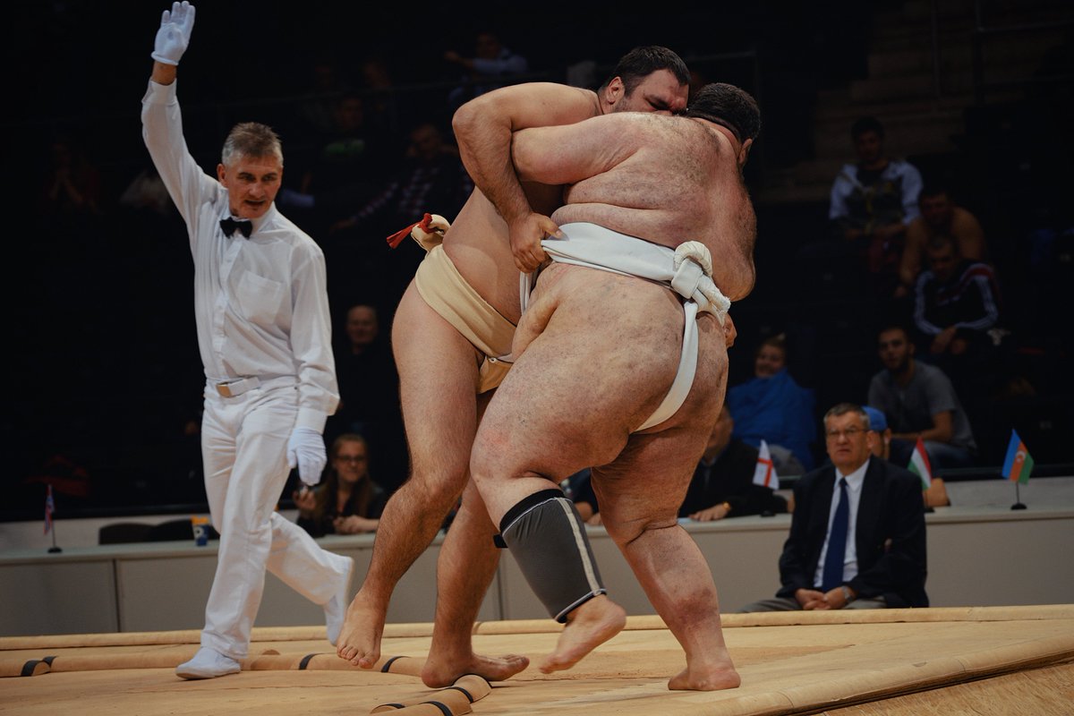 SumoDzen's tweet photo. Two massive sumo wrestlers locked tight, each gripping the other’s mawashi as their heavy bodies lean into the struggle.

#sumo #wrestler #sport https://t.co/T5xgqpaSkz