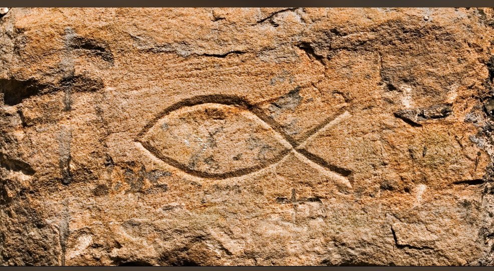 frmarcellinus's tweet photo. Catholic Symbol Explainer: The Ichthys 🐟

During Roman persecution, early Christians used a simple fish outline as a secret code word.

The Greek word for fish, ΙΧΘΥΣ, formed a hidden acrostic:
Ι = Jesus
Χ = Christ
Θ = God's
Υ = Son
Σ = Savior

During the Roman persecution, when two strangers met, one drew an arc on the ground, if the other completed the fish, both knew it was safe to speak of Christ.