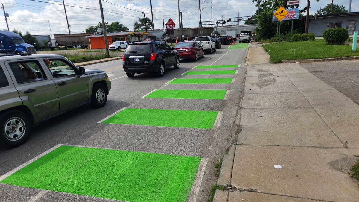 GlobeDecorative's tweet photo. We continue work of interconnecting the bike lanes in the Indy community. We’re installing the Pogues Run Greenway designated bike lane w/ applied MMAX street coating on the bike lane, marking the route located at Sherman Drive from 16th to 25th Street. https://t.co/ffZBL2Skms https://t.co/nABTqIA3jq