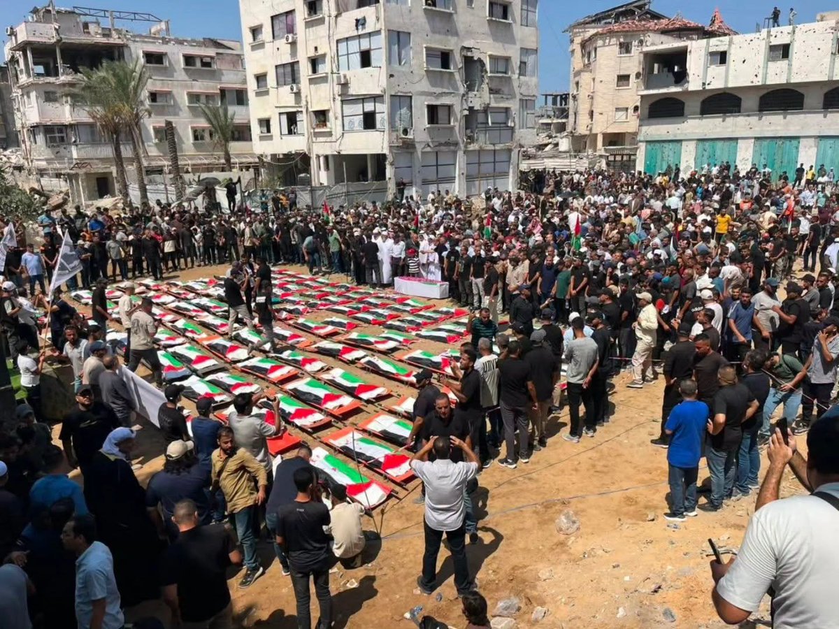 Dr_Muneer1's tweet photo. جنازةٌ بحجمِ وطن

في غزة، لم يكن هذا تشييعًا لمئةٍ واثني عشر شهيدًا فحسب...
بل كان تشييعًا لبيتٍ كامل، ولعائلةٍ كاملة، ولأحلامٍ كاملة، ولجزءٍ من روح وطن.
في ذلك المكان، لم يبقَ حجرٌ على حجر.
انهارت طوابقُ المبنى فوق ساكنيه، وتحول البيت إلى قبرٍ جماعي، بينما كانت أصوات الأطفال والنساء ترتفع من تحت الركام، تستغيث بالحياة، وتبحث عن يدٍ تمتد إليها، لكن العالم كان أصمَّ من أن يسمع، وأقسى من أن يتحرك.
هرعت سيارات الإسعاف والدفاع المدني بكل ما تبقى من أمل، وانتظرنا أن تعود وهي تحمل جريحًا، أو طفلًا نجا بمعجزة...
لكنها عادت تحمل الكلمات الأشد قسوة:
"يا دكتور... لم ينجُ أحد."
ما زالت تلك العبارة ترتجف في الذاكرة، وكأنها اختصرت المأساة كلها في ثلاث كلمات.
كيف يمكن أن يختفي بيتٌ بأكمله بمن فيه في لحظة واحدة؟
وكيف يسمع العالم صرخات الأطفال من تحت الأنقاض، ثم يواصل صمته، وكأن شيئًا لم يكن؟
اليوم، لم تكن النعوش مصطفةً في الشوارع فحسب...
بل كانت الإنسانية نفسها مسجاةً عليها.
مئة واثنا عشر شهيدًا من عائلتي الحساينة وأبو شريعة، حملتهم الأكتاف إلى مثواهم الأخير، بينما حمل التاريخ معه شهادةً جديدة على جريمةٍ ستظل وصمةً في جبين الإنسانية.
رحلوا...
لكن دماءهم ستبقى شاهدًا على أمةٍ خذلتهم، وعلى عالمٍ تركهم فريسةً لوحشيةٍ لا تعرف رحمة، وستبقى تروي للأجيال أن أطفالًا ونساءً ورجالًا استغاثوا من تحت الركام، فلم يجدوا إلا الصمت.
رحم الله شهداء عائلتي الحساينة وأبو شريعة، وجعلهم في أعلى عليين، وألهم ذويهم الصبر والسلوان.
سلامٌ على أرواحٍ ارتقت مظلومة، وسلامٌ على وطنٍ ما زال يكتب بدمائه أصدق صفحات التاريخ.

A Funeral the Size of a Nation

In Gaza, this was not merely the funeral of 112 martyrs.
It was the funeral of an entire home, an entire family, countless dreams, and a part of a nation's soul.
Nothing remained standing.
The building collapsed upon its residents, turning their home into a mass grave. Beneath the rubble, the voices of children and women cried out for help, searching for a hand to rescue them. But the world was too deaf to hear and too indifferent to act.
Ambulances and civil defense teams rushed to the scene with the last remaining hope.
We waited for them to return carrying survivors, or perhaps a child saved by a miracle.
Instead, they returned with the most devastating words imaginable:
"Doctor... no one survived."
Those words still echo in memory, capturing the entire tragedy in a single sentence.
How can an entire household disappear in a single moment?
How can the world hear the cries of children trapped beneath the rubble and continue as though nothing happened?
Today, it was not only coffins that filled the streets.
Humanity itself lay in mourning.
One hundred and twelve members of the Al-Hassayneh and Abu Sharia families were carried to their final resting place, while history recorded yet another crime that will forever stain the conscience of humanity.
They are gone.
Yet their blood will remain a lasting testimony to a world that abandoned them, leaving them at the mercy of unimaginable brutality. It will remind future generations that children, women, and men cried out from beneath the rubble, but were met only with silence.
May God grant mercy to the martyrs of the Al-Hassayneh and Abu Sharia families, raise them to the highest ranks of Paradise, and grant patience and strength to those they left behind.