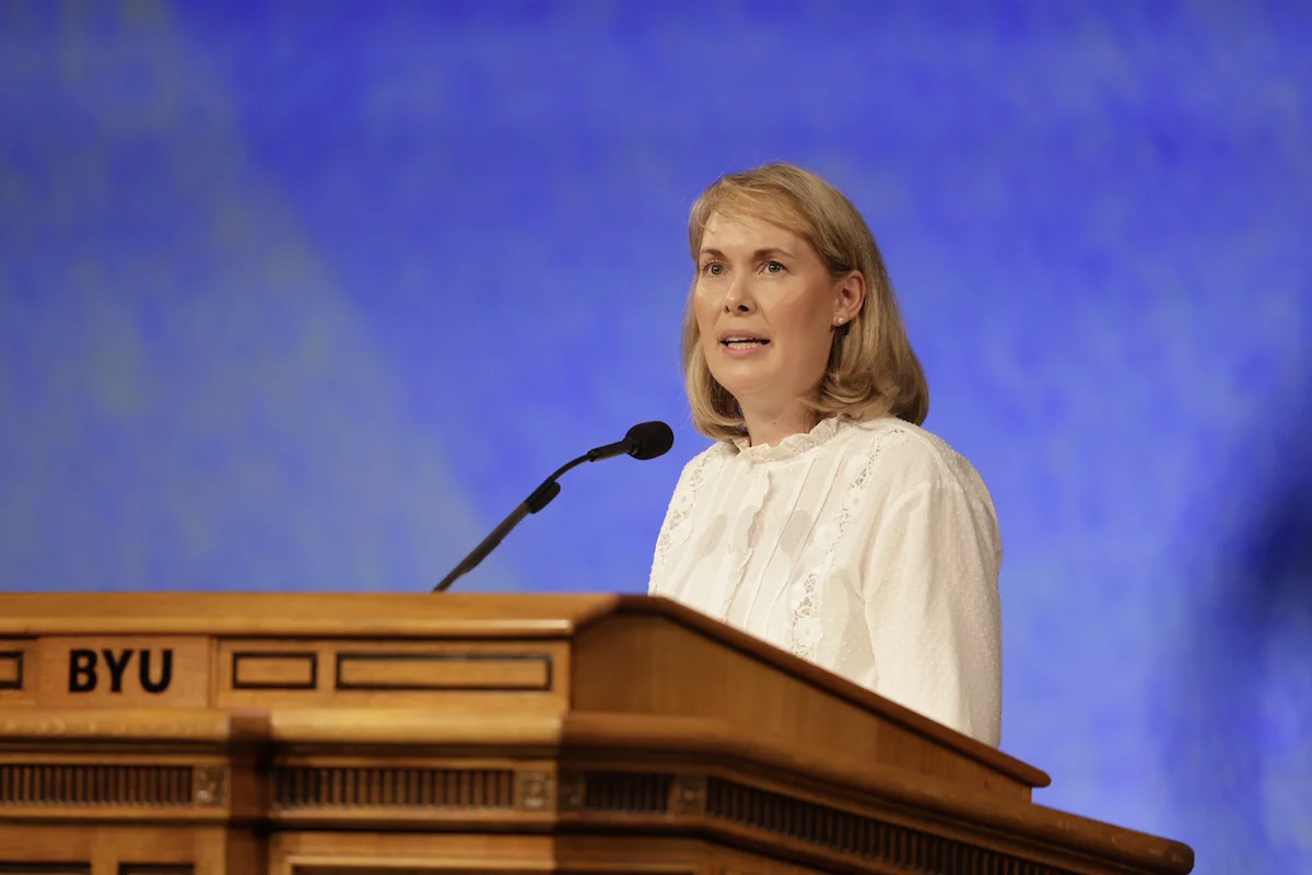 Rebecca Hunter speaks at a podium at BYU Devotional, August 2026