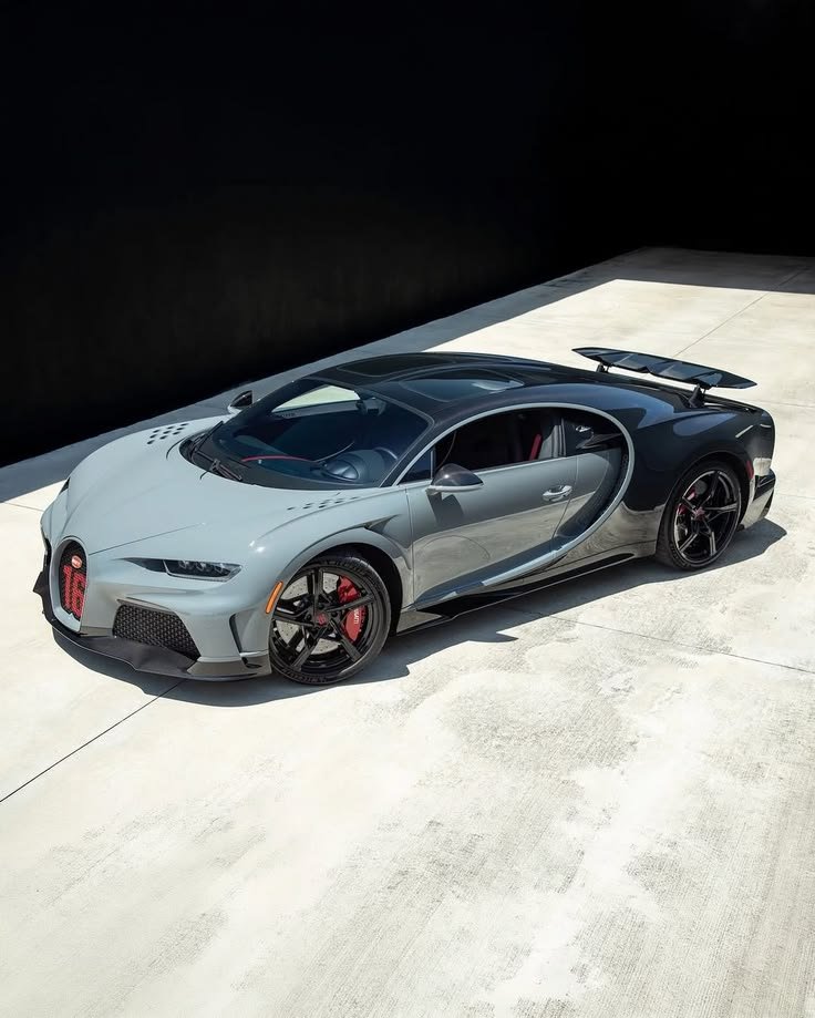 semSEH's tweet photo. Stunning two-tone grey and black Bugatti hypercar resting under the sun, French engineering at its peak. 🏎️🔥 https://t.co/KzTpijiRIk