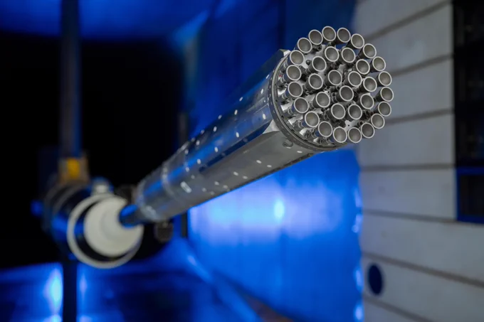 Engineers at NASA Ames conduct transonic and supersonic wind testing on a 1.2% scale model of the Super Heavy Version 3 rocket that will launch the Starship human landing system. This is a close up image of the model in the wind tunnel showcasing its 33-engines. Credits: NASA