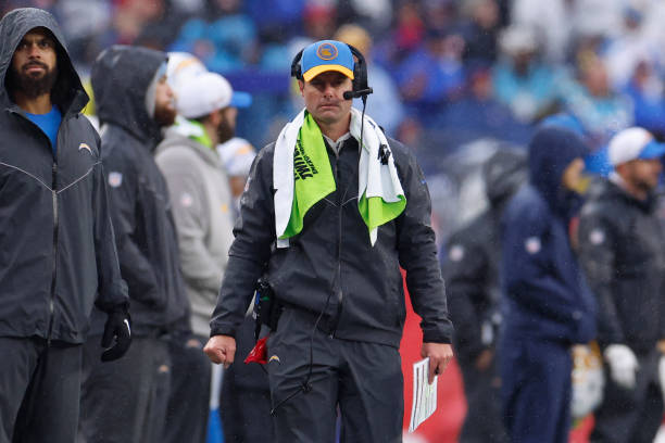 RyanPaganetti's tweet photo. The most valuable pregame signal in football might be whether the head coach decided normal pants would not cut it.

I spent an unreasonable amount of time classifying what NFL head coaches wore on the sideline over 15 seasons. I found 64 games where at least one coach wore what I classified as rain pants or weather shell pants.

The game finished under the closing total in 48 of them and over in 16. That is 75 percent unders, with those games finishing 5.8 points below the closing number on average.

These were closing totals. The market had all week to see the forecast and price the weather.

My theory is that rain pants capture the last mile of hyperlocal information. During pregame, the coach gets to stand on the exact field, feel the actual wind and rain, and decide that normal pants are not sufficient.

The play by play supports the idea. Teams averaged 50 fewer passing yards and passing EPA collapsed.

The next step is simple. Watch the pregame sideline. If you see rain pants, plan on severely downgrading expectations for the passing game and overall scoring.

Forecasts are regional. Rain pants are field level.