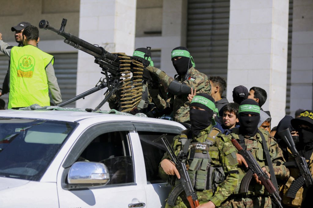 rheytah's tweet photo. The original goal of Trump's peace plan was not to relocate Hamas's arsenal. It was to eliminate it permanently.

Weapons stored in warehouses remain weapons that function.  Explosives stored today can be easily recovered tomorrow. Rocket  factories that are preserved can resume production. Tunnels that are  mapped rather than destroyed can be used again.

The issue has never been where Hamas keeps its weapons. The issue has always been Hamas having access them.

Transferring weapons from one Palestinian group to another is not demilitarization.

Even more disturbing is the new deal's assertion that "no weapons  shall be transferred or handed to Israel or non-Palestinian parties."

Equally disturbing is the new roadmap's conditioning of disarmament on an Israeli withdrawal from the Gaza Strip....

Why should a terrorist organization that carried out the October  7, 2023 massacre in Israel be allowed to dictate the conditions of its  own disarmament? No country fighting ISIS or al-Qaeda would first  withdraw its forces and only then hope terrorists voluntarily surrender  their weapons. Hamas should not be negotiating the terms of its defeat.  It should be compelled to unconditionally surrender and disarm.

This is the same Ghazi Hamad [senior Hamas official] who publicly  vowed that Hamas would repeat the October 7 massacre time and again  until Israel is eliminated: "The Al-Aqsa Flood [the name Hamas uses to  describe the October 7 massacre] is just the first time, and there will  be a second, a third, a fourth, because we have the determination, the  resolve, and the capabilities to fight."

Anyone who thinks that the newly established NCAG will somehow  confront Hamas and impose its authority over the terrorist organization  is living under an illusion.
The far more likely scenario is that Hamas will continue to call  the shots from behind the scenes while allowing another Palestinian body  to assume responsibility for governance, civil service salaries,  reconstruction, and collecting international aid.

This would essentially replicate the Hezbollah model in Lebanon,  where a heavily-armed Iran-backed terrorist militia coexists with a  formal government while retaining independent military power and  ultimate political influence.

Within hours of the announcement of the roadmap, Iran's Islamic  Revolutionary Guard Corps dismissed the plan outright, declaring... that  "the resistance" (Hamas) would remain steadfast until what it called  the "final victory" over Israel.

Iran understands Hamas better than anyone else because it has  financed, armed and trained the terrorist organization for decades. If  the Iranian regime is openly rejecting the prospect of Hamas's  disarmament, why should anyone else believe that Hamas intends to honor  the agreement?
Khaled Abu Toameh, Gatestone Institute