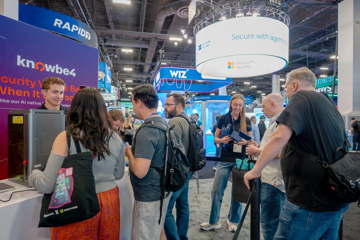 KnowBe4's tweet photo. The dream team is assembled... AKA the #Knowsters! 🧡 Stop by #BHUSA Booth 2439 this week to meet the crew and talk about securing your human + AI workforce. https://t.co/RcK9DFpqw4