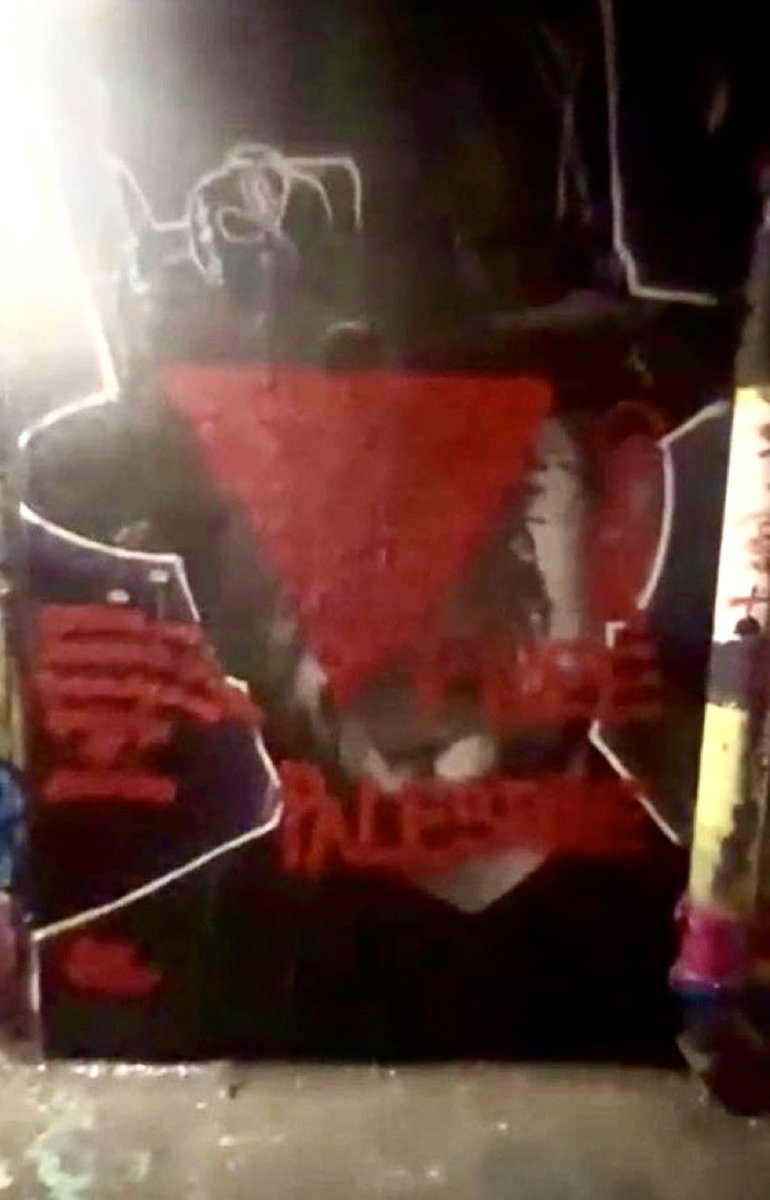 HeidiBachram's tweet photo. The mural of @BoyGeorge in Shoreditch was defaced with a Hamas red triangle last night. The terrorists use the symbol to place a target over those they plan to kill. This is a death threat. Take this seriously @metpoliceuk https://t.co/bq4ZPxV2sJ