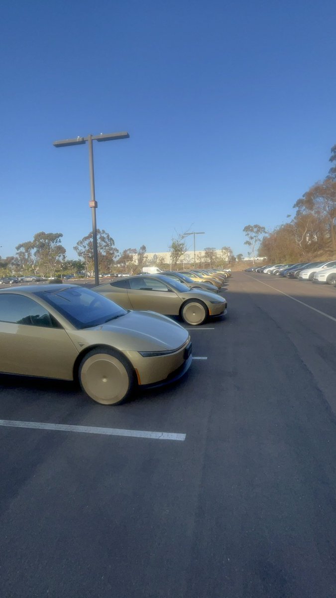 SocalTesla's tweet photo. Found 15 Cybercabs staged in San Diego with other Teslas. With steering wheels /pedals. Steering column looked like a quick disconnect. I think it is using the same tech as Cybertruck and only used if needed by service techs? @SawyerMerritt @JoshWest247 @Gfilche @DillonLoomis https://t.co/nFioW6WDjL