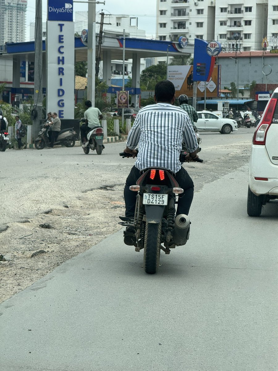 JitendraEmmani's tweet photo. This was an absolutely fine road, then dug up to lay some wires 3 weeks ago. 

It was never fixed post that, rains made it worse. 

Massive traffic jams every day due to this digging up of the road and rains on top making it worse. 

Why are the authorities letting this madness happen ?

Can this be fixed asap ??

Location: Lanco Hills Road junction, Khajaguda. 

@CMC_Offcl @CYBTRAFFIC