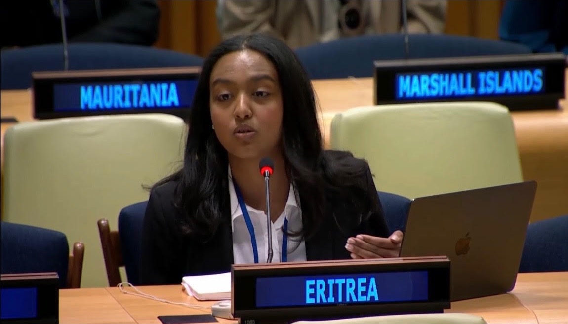 shabait's tweet photo. Grounded in History, Driven by Tech: A Diaspora Scholar’s Mission for Eritrea
By: Kidane Shimendi

Eritrean nationals living in the diaspora never stop dreaming of and contributing toward building a prosperous homeland. Ms. Yolian Ogbu is among the vibrant Eritrean youth in the diaspora tirelessly working to place Eritrean history in its rightful context and showcase the country’s rich heritage and development trajectory across the globe, particularly in the West.
Recently, she visited Eritrea to conduct field research for her PhD, focusing on Eritrea’s developmental strategy through the lens of rural solar energy projects. Eritrea Profile sat down with her for an inspiring interview about her academic journey, her advocacy, and her research.

Could you please begin by introducing yourself and sharing a bit about your background?

I grew up in the United States, raised by patriotic parents who were deeply involved in the diaspora community and actively participated in national commemorations such as Martyrs’ Day, Independence Day, and September 1st—the anniversary of the start of the armed struggle. Growing up celebrating these milestones anchored me in my Eritrean identity. I credit my parents for instilling in me the core Eritrean values and norms that continue to shape my personal vision and life goals.

While pursuing my studies in the U.S., I developed a deep passion for political science and history. I actively participated in educational competitions, debate teams, and public speaking to refine my communication skills, initially aiming to pursue a career in law. Throughout my academic journey, I constantly thought about returning to Eritrea to conduct research that would highlight the country’s true history, identity, and achievements. That drive was fueled by seeing how mainstream Western media outlets frequently disseminated misinformation about Eritrea. Studying political science and history became my way of understanding global dynamics and presenting the true image of Eritrean identity to the world.

What concrete steps have you taken so far to fulfill this personal mission?

To advance this mission, I have organized numerous educational seminars on Eritrean history, covering the period from the colonial era to the post-independence period. I also had the privilege of joining the Permanent Mission of Eritrea to the United Nations in New York, where I served as a delegate representing Eritrea at the Commission on the Status of Women for two sessions. During those sessions, I delivered speeches highlighting gender equality in Eritrea and how it was fundamentally advanced through the armed struggle. Working alongside Ambassador Sophia Tesfamariam and other experienced diplomats provided me with invaluable experience, expanding my understanding of international relations and building my confidence to engage and politically awaken young Eritreans in the diaspora.

Beyond my work with the Eritrean delegation, I engaged in broader African and global political forums through the UN platform. I traveled to Brazil as a civil society representative working with the Commission for Social Development. I traveled to Angola to conduct workshops for African and diaspora youth focusing on national development and the economic exploitation of African resources. As a political science scholar, my focus centers on addressing inequities in the international system and confronting corporate exploitation across the African continent. Fulfilling my mission for Eritrea goes hand in hand with encouraging fellow African youth to build political consciousness and pursue sovereign progress.

To counter misinformation campaigns, I regularly write articles and reports, participate in television and radio interviews, and deliver presentations to audiences comprising Western observers and the African diaspora. Currently, I am pursuing my PhD in Anthropology at the University of Chicago, where my doctoral research focuses on energy infrastructure in Eritrea.

What core values or historical legacies inspire you as you confront misinformation and engage in advocacy?

The history of the armed struggle for independence has been a profound source of inspiration for me since childhood. The immense sacrifices paid for national liberation, the resilience demonstrated against all odds, the resistance to colonial aggression, and the deep spirit of comradeship are memories I hold close to my heart. They drive my commitment to combating misinformation and raising political consciousness among diaspora youth and fellow Africans.

Above all, the national ethos of “Never Kneel” inspires my work. Looking through Eritrean history, you quickly recognize the power of the core values forged during the struggle: unity in diversity, resilience, determination, sacrifice, self-reliance, and religious harmony. These values were the ultimate assets of the Eritrean people during the struggle for self-determination, and they remain the driving force behind the nation’s contemporary development programs.

Tell us about your current PhD research thesis.

My research focuses on Eritrea’s national development strategy through the framework of renewable energy projects, specifically solar energy. The central objective is to explore and document Eritrea’s unique, sovereign development model as a valuable case study for the African continent.

While many development strategies across Africa remain heavily reliant on external aid or influenced by former colonial powers—often contributing to economic vulnerability— Eritrea pursues a sovereign, self-determined model. It prioritizes rural development and basic social services. When traveling across the country, the equitable distribution of essential services—such as education, clean water, healthcare clinics, transport, and energy supplies in rural communities—is clearly visible. Rather than relying entirely on foreign aid or external experts, these initiatives are planned and executed using local capacity, skills, and strategies.

Self-reliance is the bedrock of this model. It is an approach forged during the liberation struggle that continues to guide the nation-building process today. Unlike policy frameworks imposed from the outside, self-reliance in Eritrea is a culturally embedded practice. It is even reflected in long-standing Tigrinya proverbs, such as “The one who relies on others wears out like a shoe” or “Begging turns a person into an ape,” demonstrating how autonomy is woven into the national identity.

I specifically chose solar energy for my field study to examine how Eritrea is deploying clean energy technology in rural areas as part of its national strategy. As climate change and sustainable energy become central global topics, sharing Eritrea’s practical experiences in local energy management offers meaningful insights for economic independence across Africa.

Finally, what message would you like to share with Eritrean youth at home and in the diaspora?

Let us stay conscious, organized, and equipped!

One of the most powerful principles from our history is summed up in the spirit of “Never Kneel” and the classic adage, “The dogs may bark, but the camel continues its march.” In a rapidly changing global landscape, we—especially the youth—must remain grounded in our history and continually build our political consciousness. It was national consciousness and unity that secured victory in the struggle for independence against incredible odds, and it is that same strength that will enable us to build the prosperous nation we envision.

Ms. Yolian, thank you for sharing your time and insights with us, and we wish you continuous success in your academic and professional endeavors.