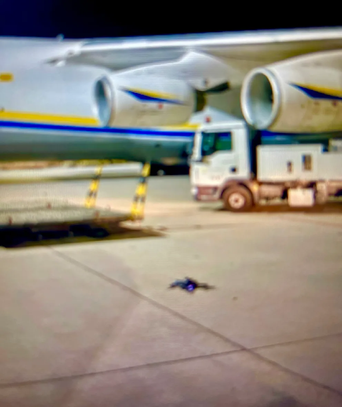 sentdefender's tweet photo. German authorities are investigating what appears to have been an attempted explosive drone attack at Leipzig/Halle Airport after a drone carrying an explosive device was discovered near Ukrainian cargo aircraft, according to BILD.

BILD reports the drone was found late Tuesday night on the airport apron with an attached package that security authorities identified as containing explosive material after a positive nitrate test. An X-ray reportedly revealed a detonator, but investigators believe it malfunctioned, preventing the device from detonating. The explosive package has been preserved for forensic examination rather than destroyed, and BILD reports NATO investigators are expected to participate in the investigation.

The incident occurred near several Ukrainian Antonov cargo aircraft at one of Europe's most important cargo hubs, including shipments supporting Ukraine. Airport operations were temporarily suspended following the discovery.

BILD also reports that shortly after the airport was closed, a DHL cargo aircraft aborted its landing and later struck an unidentified object approximately 400 meters above the ground and about six kilometers from the airport. The aircraft landed safely in Hanover, where damage to its nose section was discovered. German authorities have confirmed the collision occurred and are investigating it as a state security matter, though they have not publicly confirmed that the object was a drone or linked it to the explosive device.